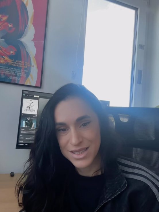 Sole in her studio chair, talking to the camera